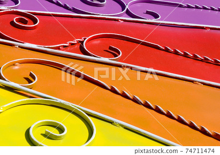 Metal texture of a piece of colored wall with a forged pattern Metal texture of a piece of colored wall with a forged pattern 74711474
