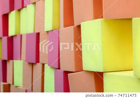Wall of paralon soft cubes in dry pool, trampoline in the childrens center Wall of paralon soft cubes in dry pool, trampoline in the childrens center 74711475