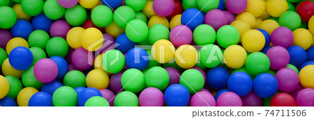 Swimming pool for fun and jumping in colored plastic balls Swimming pool for fun and jumping in colored plastic balls 74711506