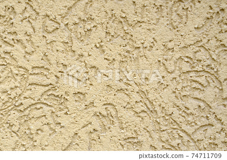 The texture of the beige decorative plaster in bark beetle style The texture of the beige decorative plaster in bark beetle style 74711709