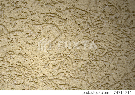 The texture of the beige decorative plaster in bark beetle style 74711714