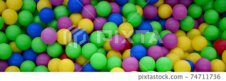 Swimming pool for fun and jumping in colored plastic balls Swimming pool for fun and jumping in colored plastic balls 74711736