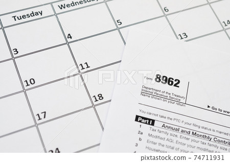 IRS Form 8962 Premium tax cerdit PTC blank lies on empty calendar page 74711931