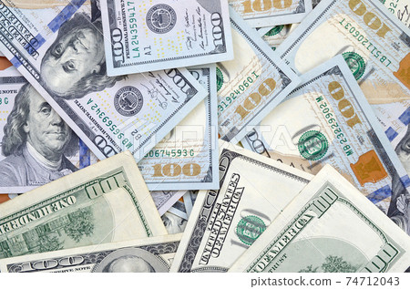 Top view of one hundred dollar banknotes made background. USD currency concept and rich life Top view of one hundred dollar banknotes made background. USD currency concept and rich life 74712043