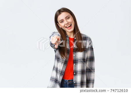 Lifestyle, different emotions, leisure activities concept. Carefree friendly happy girl pointing at camera, picking you, congratulating. HR female employee found perfect job, smiling enthusiastic Lifestyle, different emotions, leisure activities concept. Carefree friendly happy girl pointing at camera, picking you, congratulating. HR female employee found perfect job, smiling enthusiastic 74712610