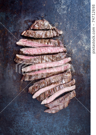 Barbecue dry aged wagyu flank steak sliced Barbecue dry aged wagyu flank steak sliced 74712698
