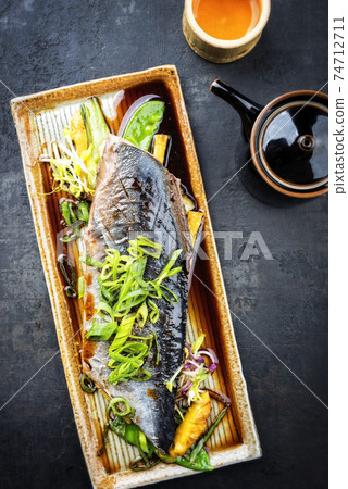 Japanese bonito tuna fish filet with vegetable and pineapple glazed in teriyaki sauce Japanese bonito tuna fish filet with vegetable and pineapple glazed in teriyaki sauce 74712711