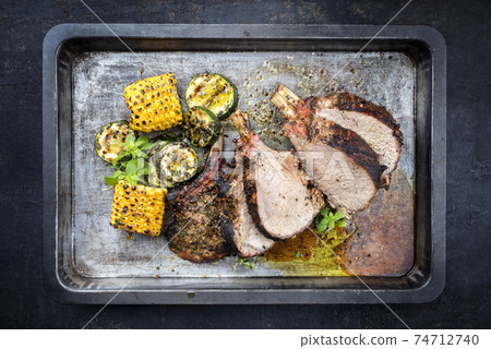 Exotically barbecue veal back racks squares roast with green asaparagus and pineapple 74712740