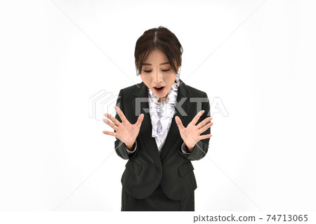 Surprised woman in suit 2 white background Surprised woman in suit 2 white background 74713065