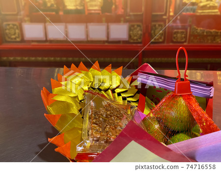 Joss paper and Chinese ancestor Worship is believed to send material wealth to deceased relatives. 74716558