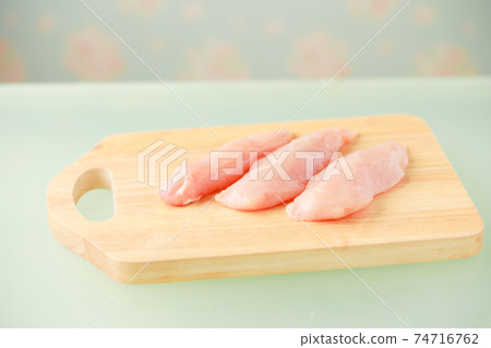 Raw Chicken Breast On A Wooden Cutting Board Stock Photo, Picture and  Royalty Free Image. Image 27433651.