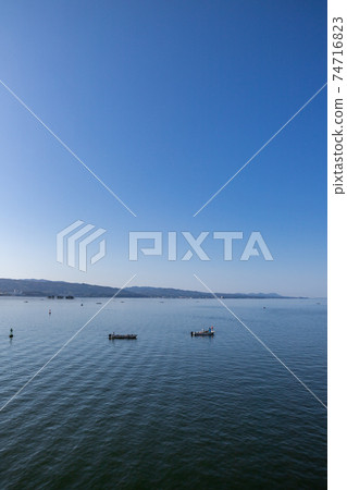 Lake Shinji and freshwater clam fishing in the early morning Matsue City, Shimane Prefecture 74716823