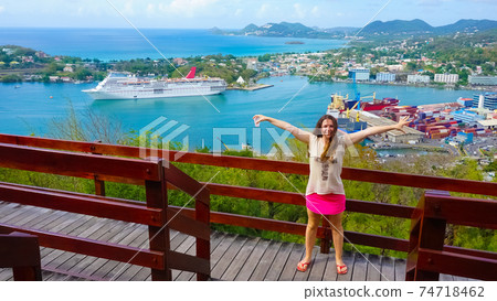 The woman posing against port or cruise dock at Saint Lucia island The woman posing against port or cruise dock at Saint Lucia island 74718462