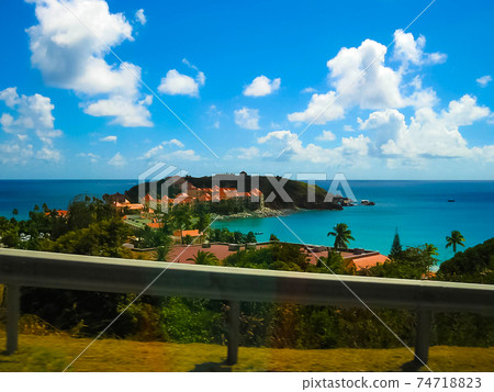 The view of the island of St. Maarten on a sunny day The view of the island of St. Maarten on a sunny day 74718823