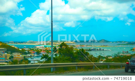 The view of the island of St. Maarten on a sunny day The view of the island of St. Maarten on a sunny day 74719018