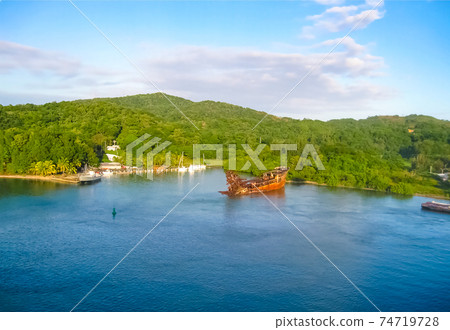 An aerial view of a tropical beach in Roatan Honduras 74719728