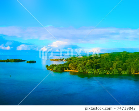 An aerial view of a tropical beach in Roatan Honduras An aerial view of a tropical beach in Roatan Honduras 74719842