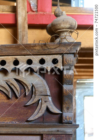 Old russian carved wooden window trim with funny wire spectacles Old russian carved wooden window trim with funny wire spectacles 74721500