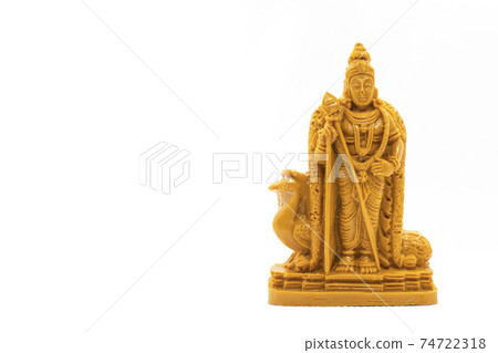 The hand-carved wooden statue of Lord Murugan is isolated on a white background The hand-carved wooden statue of Lord Murugan is isolated on a white background 74722318