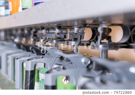 Paint mixer Mixing machine mixing paint for cars close-up selective focus. Selection of car accessories Paint mixer Mixing machine mixing paint for cars close-up selective focus. Selection of car accessories 74722860