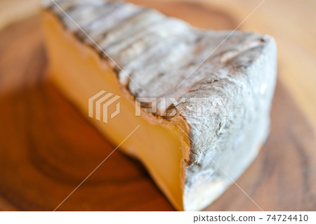 Moldy and aged natural cheese Moldy and aged natural cheese 74724410