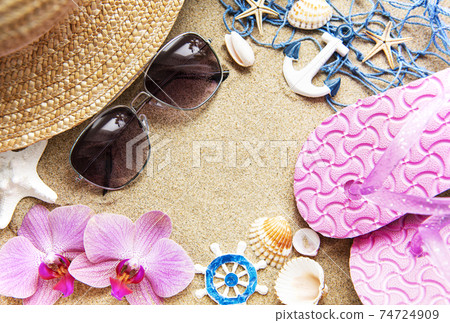 Top view of beach accesories on sands with copy space Top view of beach accesories on sands with copy space 74724909