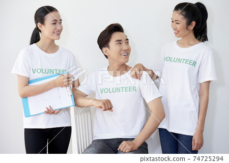 Team of young volunteers Team of young volunteers 74725294