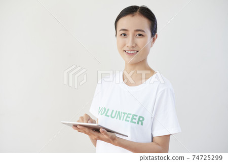 Volunteer with tablet computer Volunteer with tablet computer 74725299