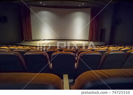 Empty chairs in the stands of the movie theater.  74725310