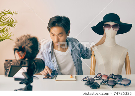 Vlogger or Blogger Using Smartphone to Check Order and Chat with Customer in Vintage Tone Vlogger or Blogger Using Smartphone to Check Order and Chat with Customer in Vintage Tone 74725325