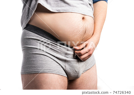 The belly of a fat man on an isolated background 74726340