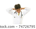 Doctor with tired expression 74726795