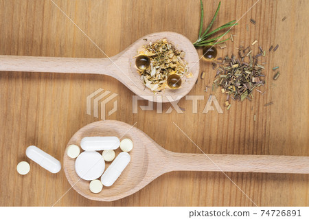 Homeopathic medication with tablets . Alternative medicine with herbal and homeopathic pills Homeopathic medication with tablets . Alternative medicine with herbal and homeopathic pills 74726891