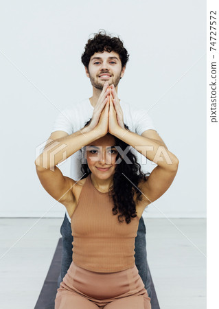 Male and female doubles yoga asana gymnastics fitness 74727572