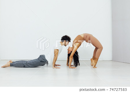 Man and woman paired family yoga asana gymnastics fitness 74727583