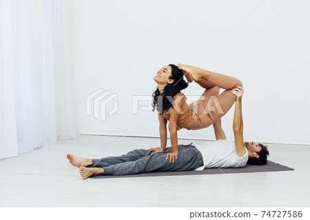 Man and woman paired family yoga asana gymnastics fitness 74727586