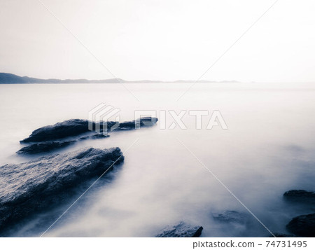 Long Exposure of Sea with Smooth Wave and Rock landscape. Nature of Seascape vacation holiday season time for relax travel 74731495