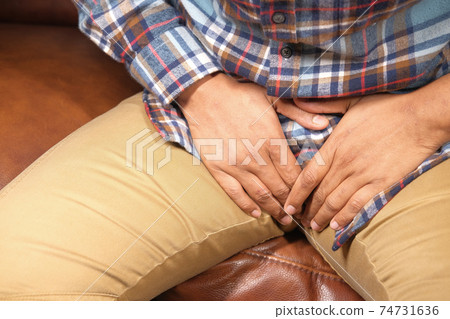 the concept of prostate and bladder problem, crotch pain of a young person the concept of prostate and bladder problem, crotch pain of a young person 74731636