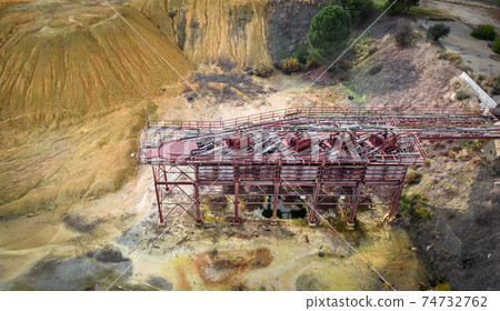 Mining tailings and old rusty machinery, view from above Mining tailings and old rusty machinery, view from above 74732762