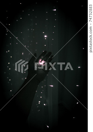 Holding a little light in the dark 74732883