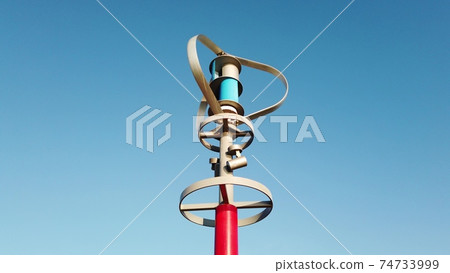 Vertical axis wind turbine generating electric energy while spinning against blue sky. 74733999