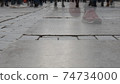 People feet walking on crowd city street. Pedestrians at the izmir city, Turkey. Motion blur. 74734000