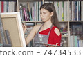 Charming young woman painting at art workshop 74734533