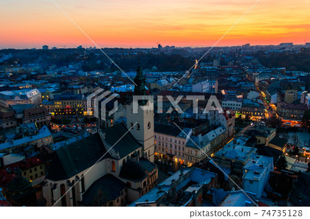 Aerial view of Latin cathedral and Rynok square in Lviv, Ukraine at sunset. View from Lviv town hall Aerial view of Latin cathedral and Rynok square in Lviv, Ukraine at sunset. View from Lviv town hall 74735128