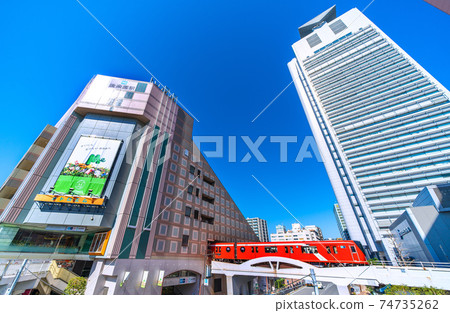 View of Tokyo cityscape in Japan, such as Bunkyo Ward Office and Tokyo Metro Korakuen Station that shine in the blue sky 74735262