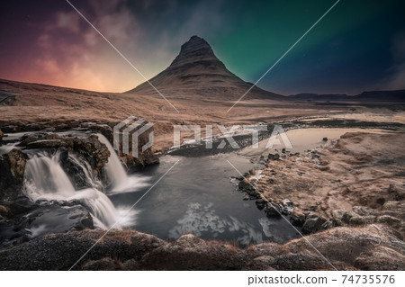 Northern lights aurora borealis over kirkjufell waterfall in Iceland Northern lights aurora borealis over kirkjufell waterfall in Iceland 74735576