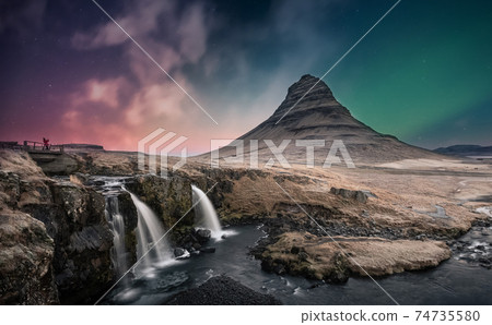 Northern lights aurora borealis over kirkjufell waterfall in Iceland Northern lights aurora borealis over kirkjufell waterfall in Iceland 74735580