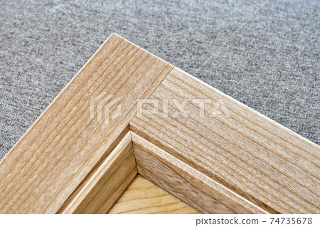 Stylish detail of furniture facade of veneer and solid ash 74735678