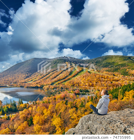 Woman hiking at Artist's Bluff in autumn 74735995