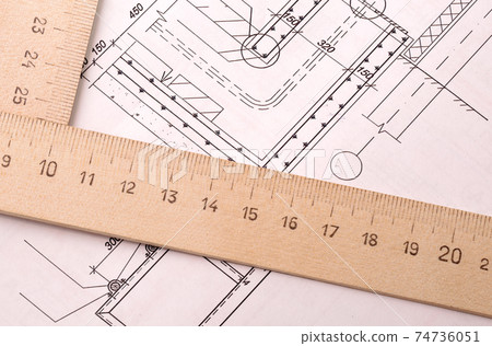 Architectural design, drawing paper and wooden ruler on a table close up Architectural design, drawing paper and wooden ruler on a table close up 74736051